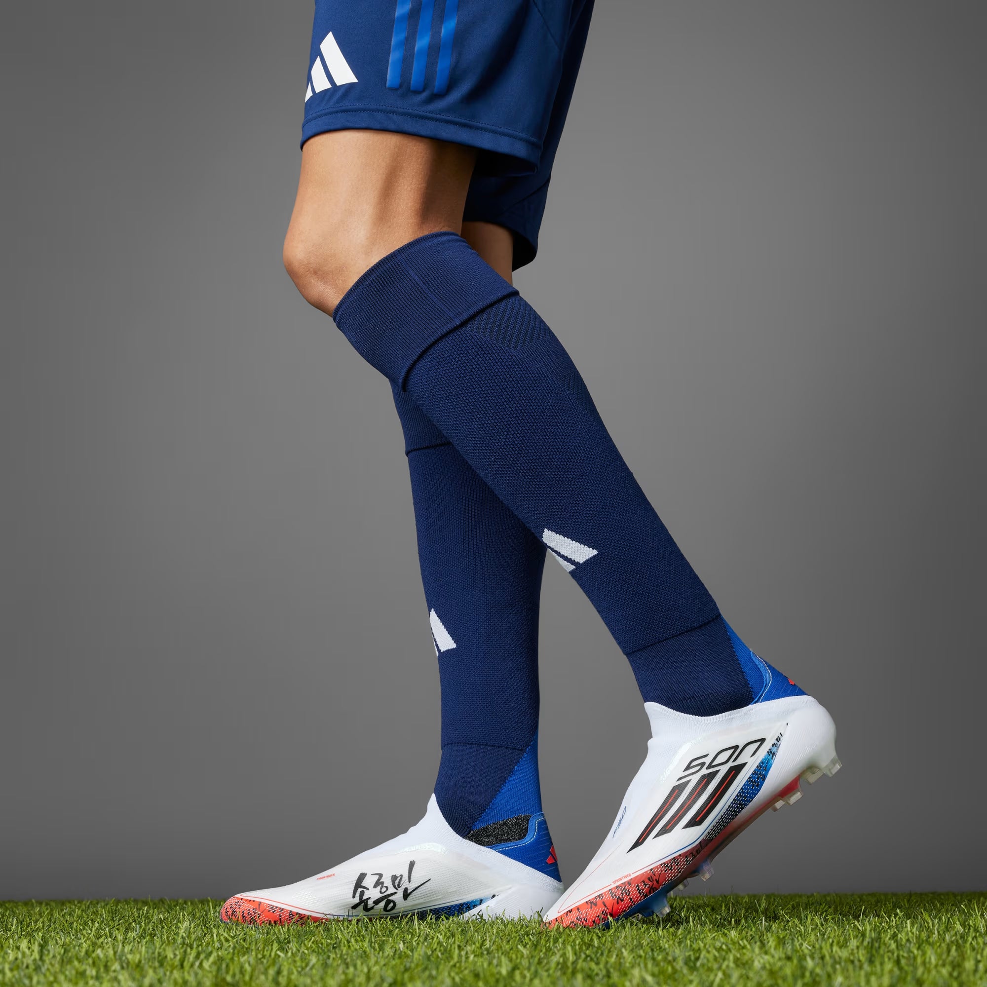 F50 ELITE SON LACELESS FIRM GROUND CLEATS