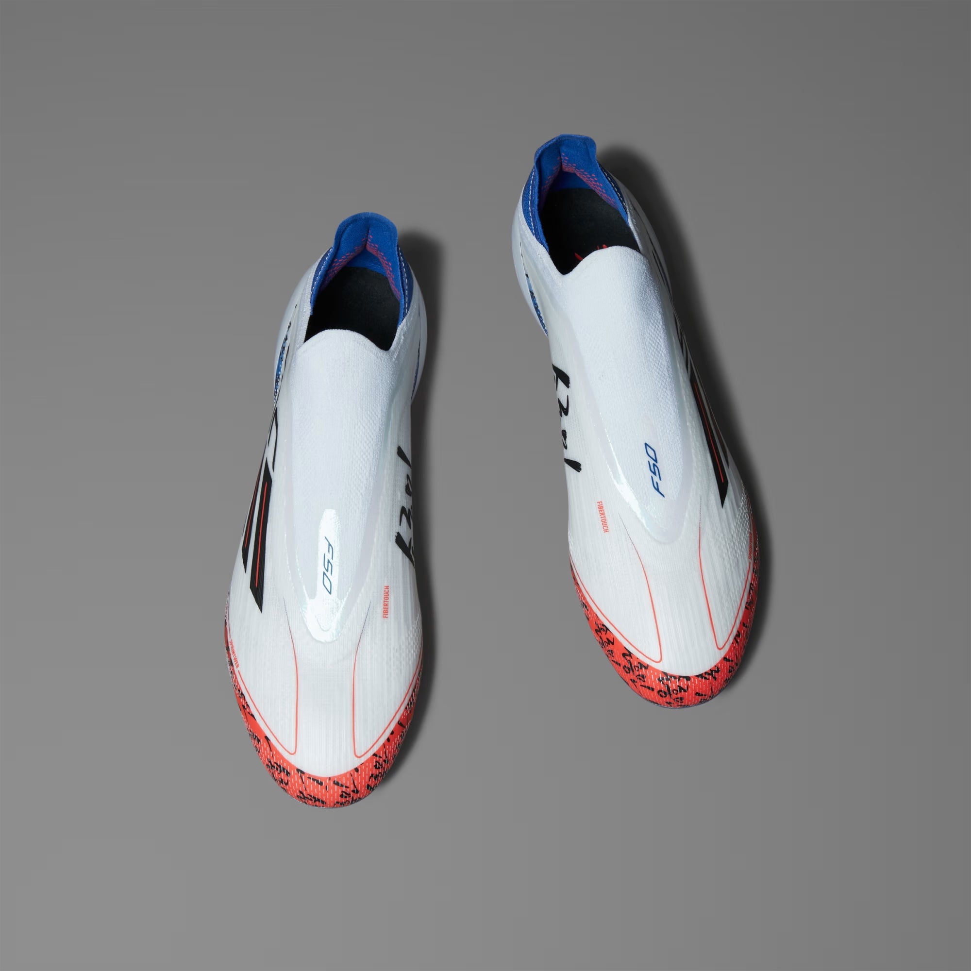 F50 ELITE SON LACELESS FIRM GROUND CLEATS